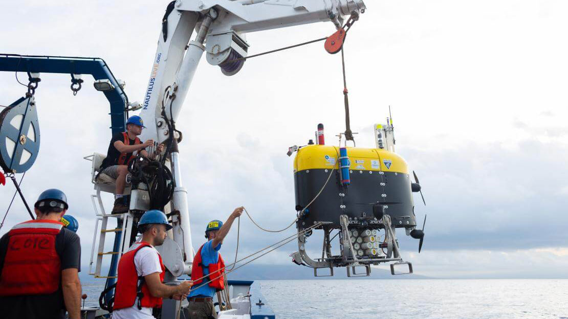 Autonomous underwater vehicle Mesobot being deployed from the deck of Exploration Vessel Nautilus.