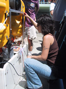 Wanda prepares the OBS (ocean bottom seismometer) for deployment over the East Pacific Rise.