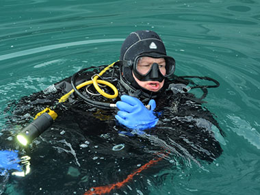 Dr. Kelley emerging from the icy waters of Glacier Bay National Park, during the Deepwater Exploration of Glacier Bay National Park expedition.
