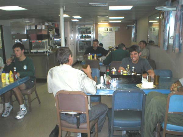 The Ron Brown’s officers, crew and scientists enjoy lunch in the mess area.
