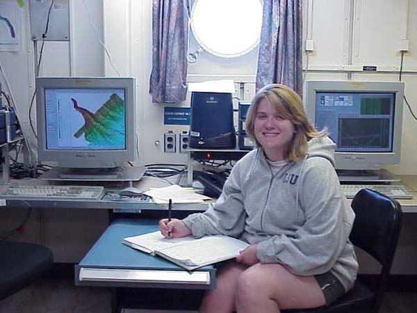 Tammie Middleton marking an event in the research log during her 12-4 pm scientific watch.