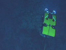 ROV Hercules attached by a long cable to ROV Argus