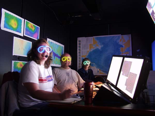 It's 2:00 in the morning, we're 1,500 miles from Chicago, it's dark, and we're wearing glow in the dark glasses. Kate Buckman of the Woods Hole Oceanographic Institution (WHOI), Peter Auster of the University of Connecticut, and Susan Mills of WHOI on watch in the control van.  