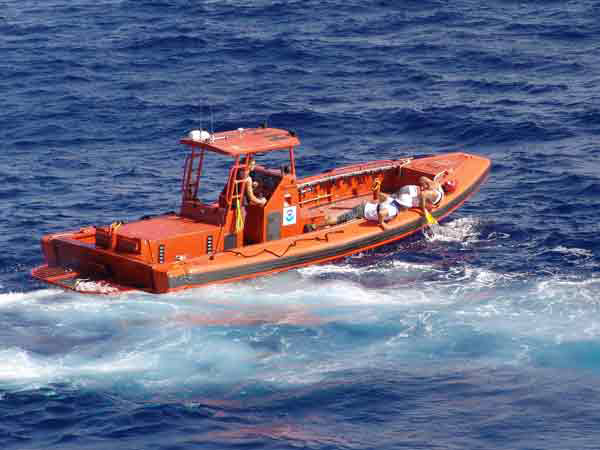  Hi'ialakai crew members search for debris