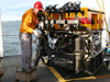Curt adjusts the ROV's lasers that aid us in determining our field of view and the size of objects on the video screen.