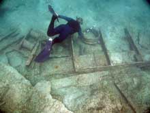 A member of the expedition investigates the metal-hulled wreck discovered in 2004.