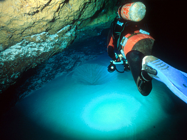 Funnel-shaped depression in the sand floor of Tucker’s Town Cave, suggesting the presence of a lower level.