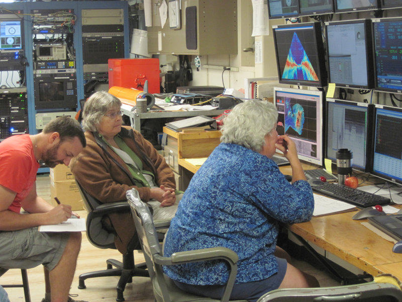 Scientists in computer lab on board the R/V Roger Revelle examine multibeam and CTD data.