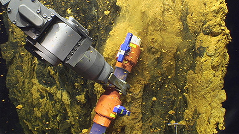 The scoop sampler allows the microbiologists to collect bulk samples of microbial mat.
