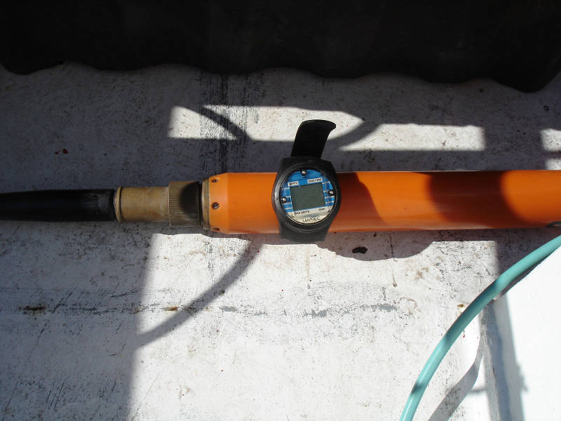 Magnetometer towfish with diver’s wrist-mounted depth gauge attached for depth control experiment.