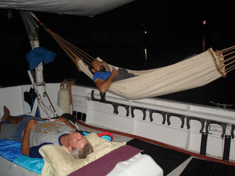 Sam and Brian sleep out on deck tonight, with the canopy overhead protecting from light rains.
