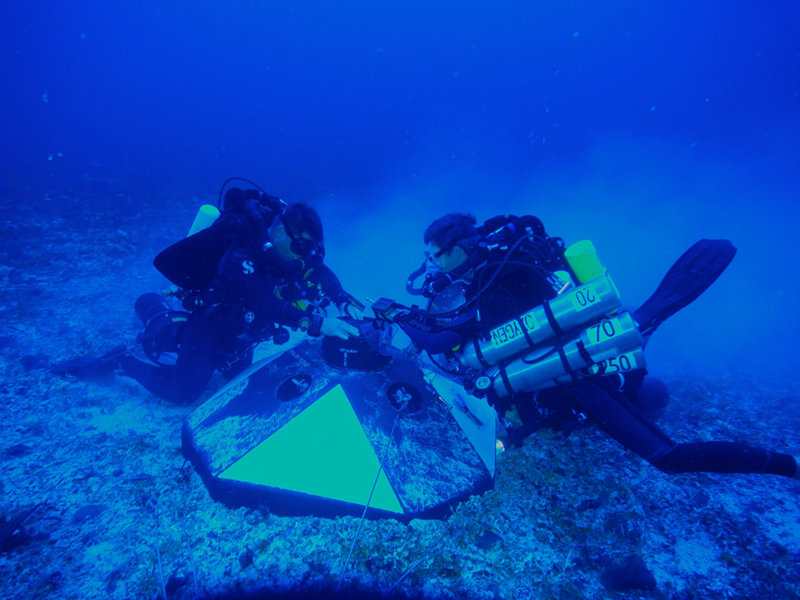 Figure 1. The University of Miami's technical dive team installs an acoustic Doppler current profiler (ADCP) on a subsurface mooring to collect information on ocean currents.