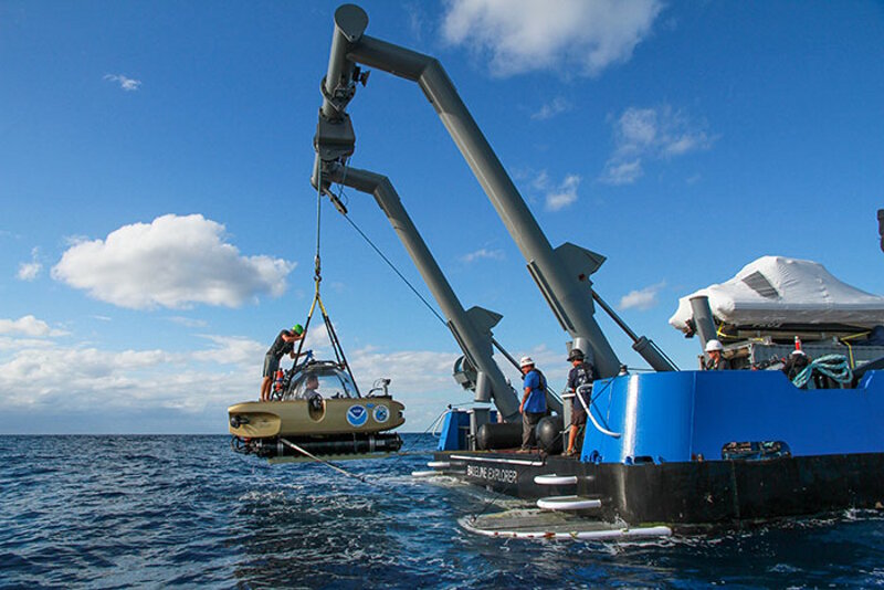 Project Baseline's Nomad Submersible is hoisted aboard R/V Baseline Explorer after resurfacing from a dive.