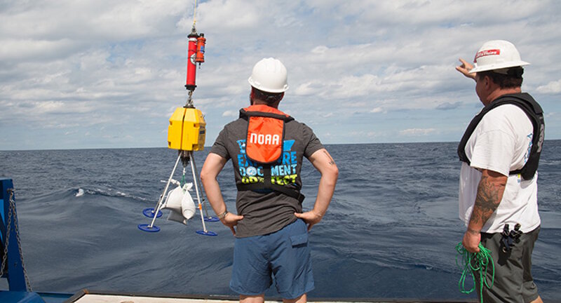 The transponder pod is lowered off the R/V Baseline Explorer to sink to the seafloor.