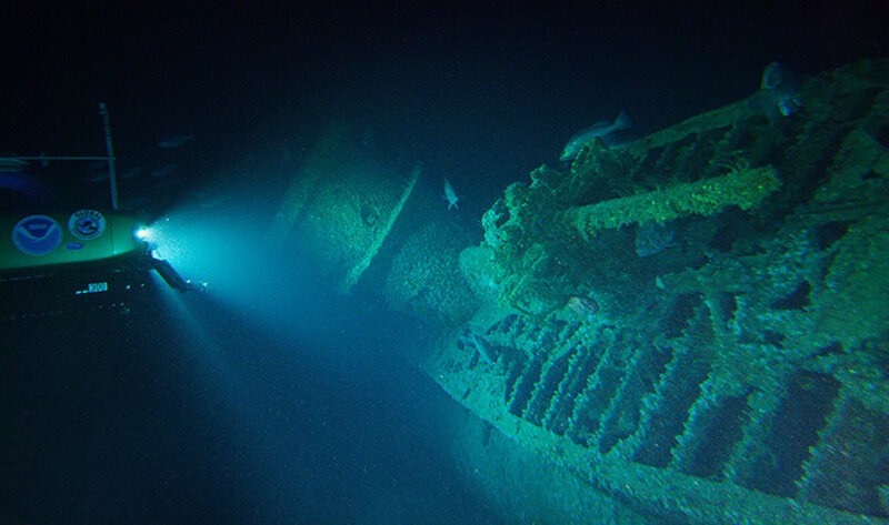 The wreck of U-576 lying on its starboard side.