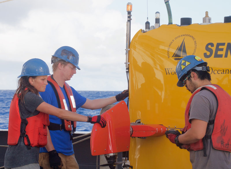 Molly and other members of the AUV team prepare Sentry for deployment.