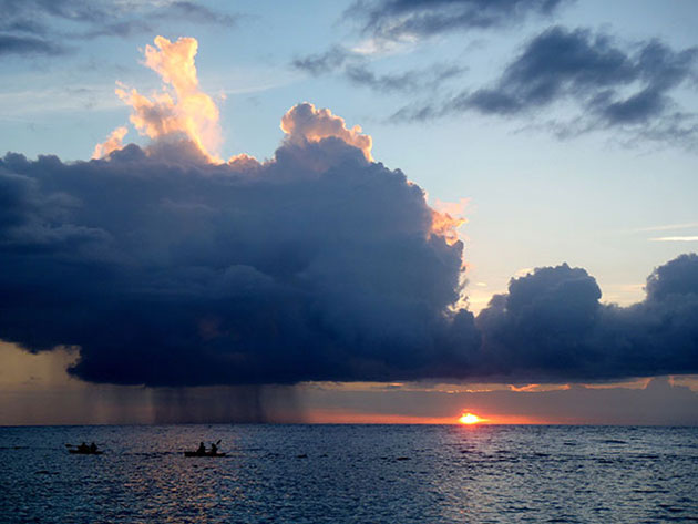 December 2012, Roatan, Honduras Ocean storm and kayakers.