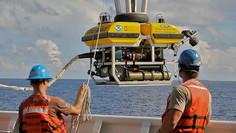 <em>Okeanos Explorer</em> crew launch the vehicle during test dives off Hawaii.