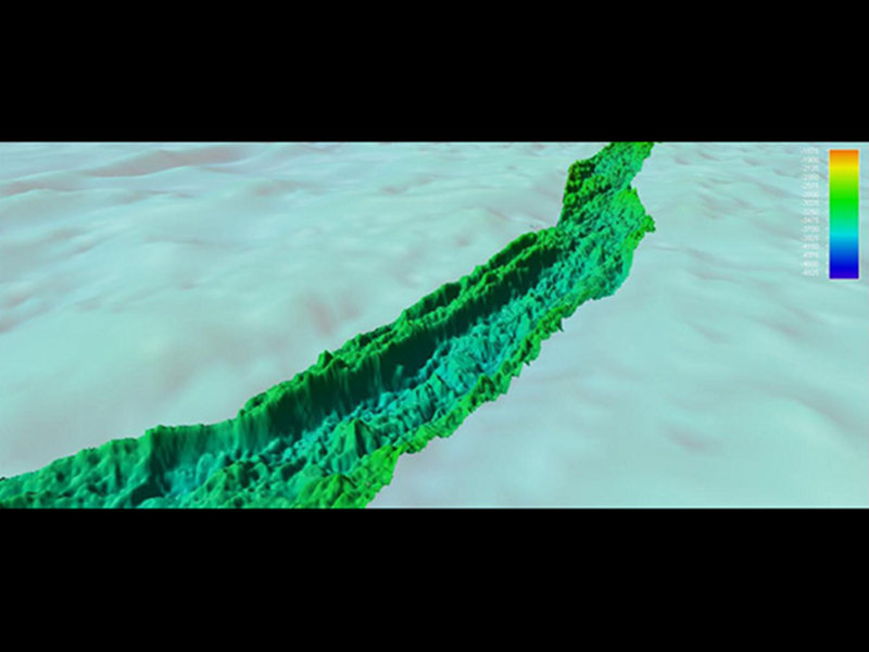 Oblique angle showing detail of gridded EM302 multibeam bathymetry along Western Galápagos Rift. Depth color bar in meters. Background satellite-altimetry derived data courtesy of Sandwell and Smith.