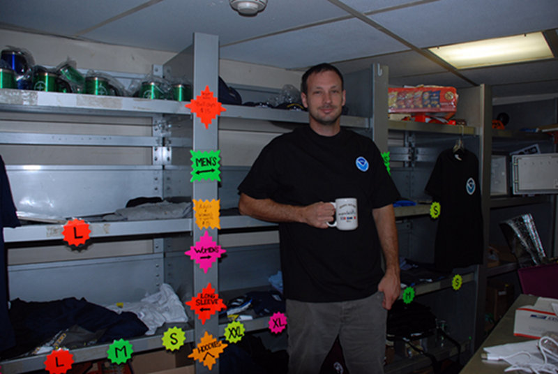 Crew member and store manager Liam Vickers sells novelties and necessities such as hats, snacks, t-shirts and mugs. Store managers monitor popular products, such as Dr. Pepper soda, then stock up when the ship is in port.