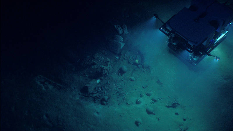 NOAA’s Seirios camera platform images the ROV Deep Discoverer shining its lights on the stern section of Monterrey wreck site B.