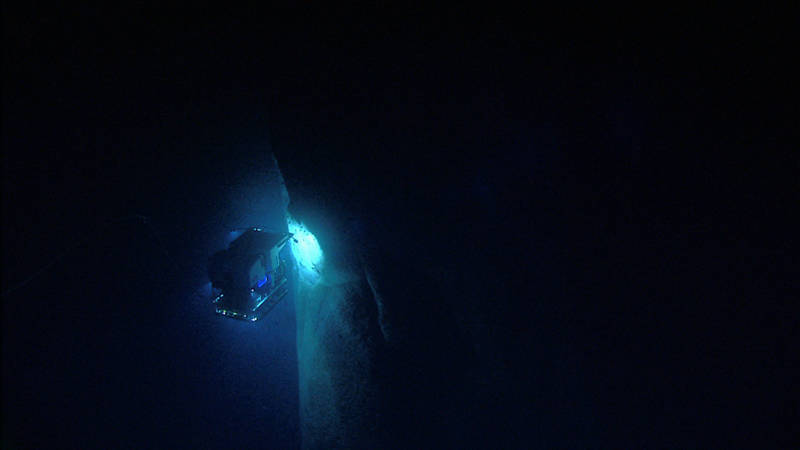 Remotely operated vehicle Deep Discoverer investigates an unexplored canyon wall.