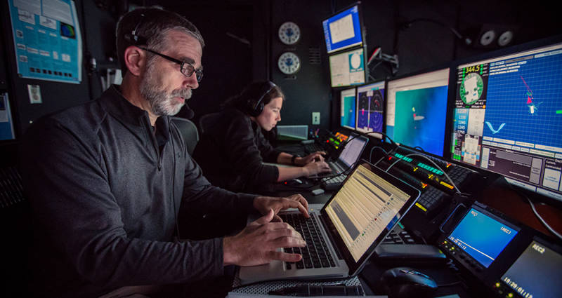Scott France and Susan Schnur hard at work in the control room at the end of a dive.