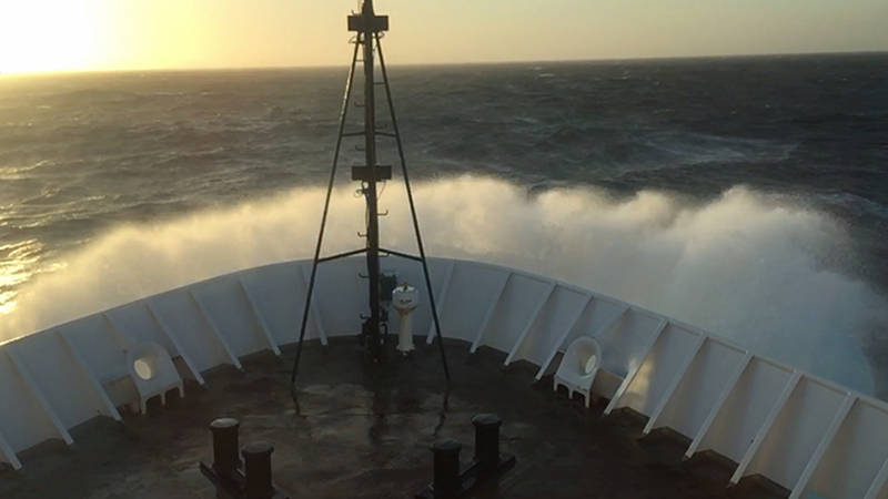 Rough seas break over the bow of NOAA Ship Okeanos Explorer during the transit back to Honolulu, Hawaii.