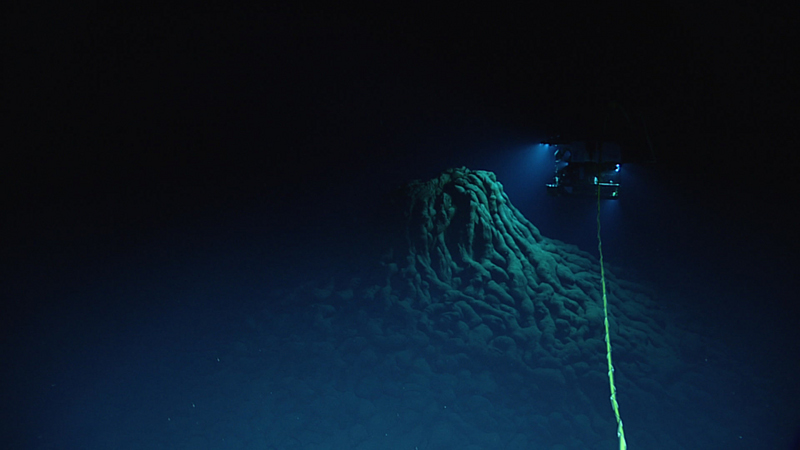 ROV Deep Discoverer explores an eruptive vent at the top of a large mound of pillow lavas.