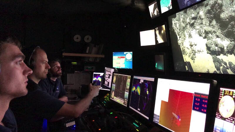 The ROV pilot controls D2's grasping arm, while the co-pilot points the main camera.