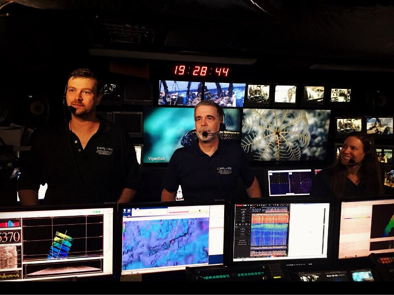 Geology Lead Scientist, Dr. Del Bohnenstiehl (left), and Biology Science Lead, Dr. Scott France (middle), answer questions during the first-ever NOAA Ship <em>Okeanos Explorer</em> live Facebook interaction.