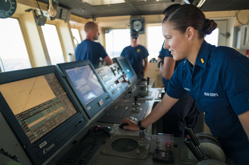 Ensign ENS Brianna Pacheco works on navigation systems on the bridge of NOAA Ship Okeanos Explorer in preparation for an ROV dive.