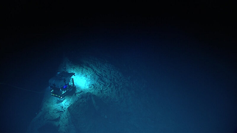 ROV Deep Discoverer explores the edge of a sharp ridge feature at Mozart Seamount.