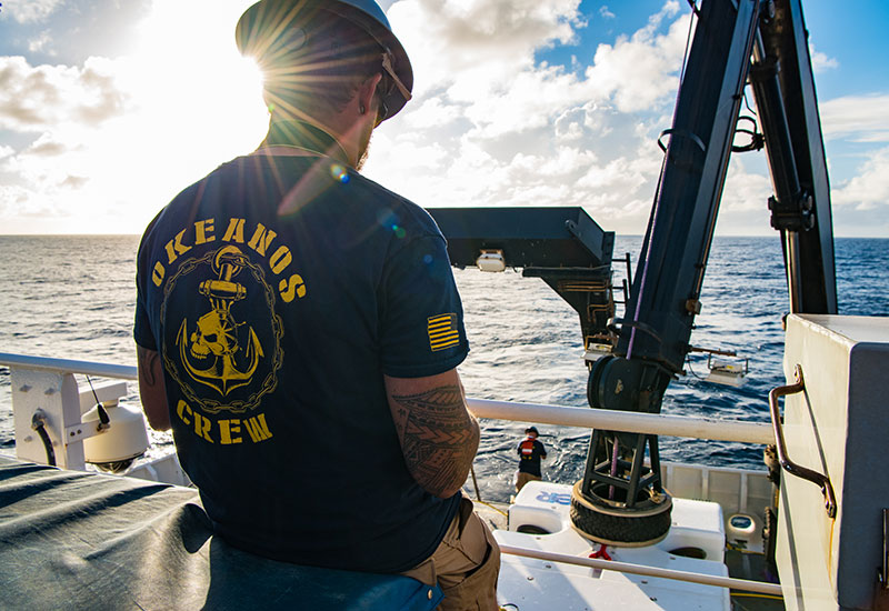 NOAA Ship <em>Okeanos Explorer</em>’s crew are essential to completing each of the ship's operations, including the recovery of the remotely operated vehicle Deep Discoverer, as seen here.