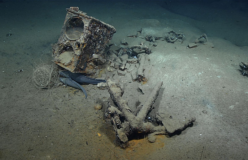 During Dive 02 of the 2022 ROV and Mapping Shakedown, we explored the wreck of what is likely a 19th century whaler. Seen here are the remains of the ship's tryworks, a furnace that was used to render whale blubber into oil, and an anchor, as well as two fish that resemble a species commonly associated with shipwrecks.