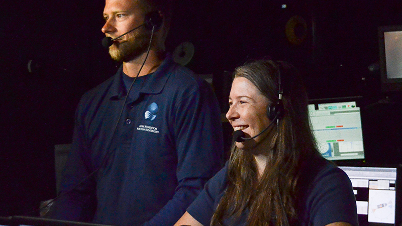 Kelley Suhre (right) and a fellow explorer conduct a live interaction with visitors at the Exploratorium in San Francisco, California, while aboard NOAA Ship Okeanos Explorer.