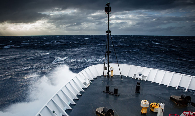 The Okeanos Explorer beats its way into heavy seas.