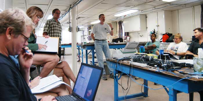 Dr. McDonough leads science discussions on board the NOAA Ship Ronald H. Brown.