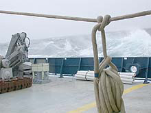 Wind and waves off the port stern