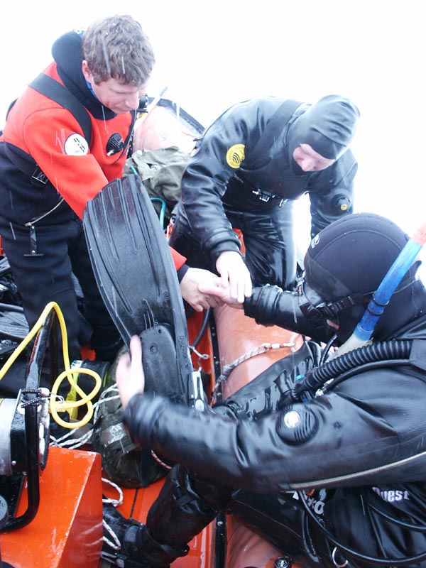Divers preparing to jump in the Arctic water