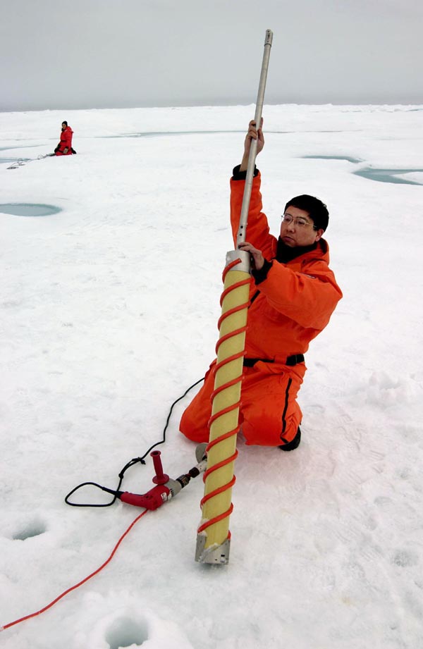 Qing Zhang removes an ice core