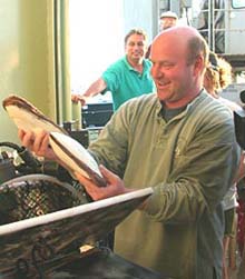 Co-Chief Scientist Tim Shank delightedly removes clams from Alvin's basket
