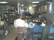 The ship's crew in the serving line at dinnertime.