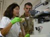 Shirley Pomponi and LTJG Shawn Maddock view a sponge