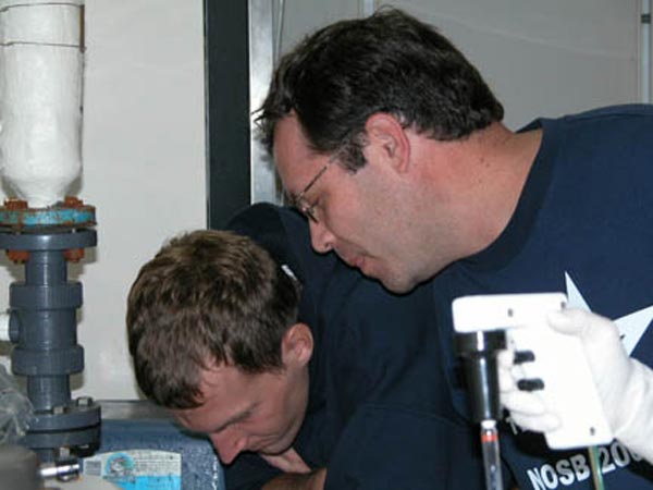 Jeremy Potter and Gary K. Wolfe getting their hands wet examining Forcepia
