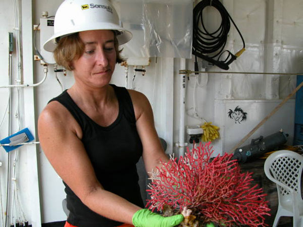 Gail Samples displays a coral collected during an ROV dive.