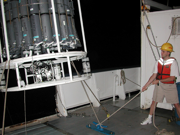 Just before midnight, Fred Andrus, helps to lower the 2400 lb CTD over the ship’s starboard side.