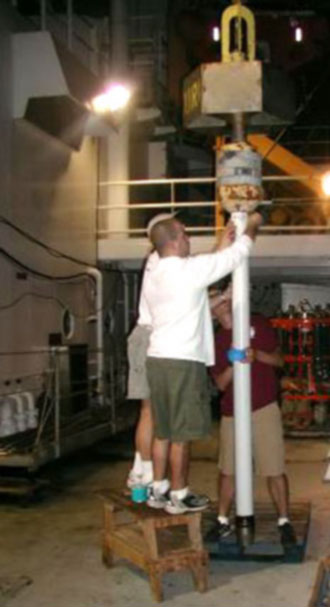 Scientists from the University of Rhode Island prepare the coring apparatus