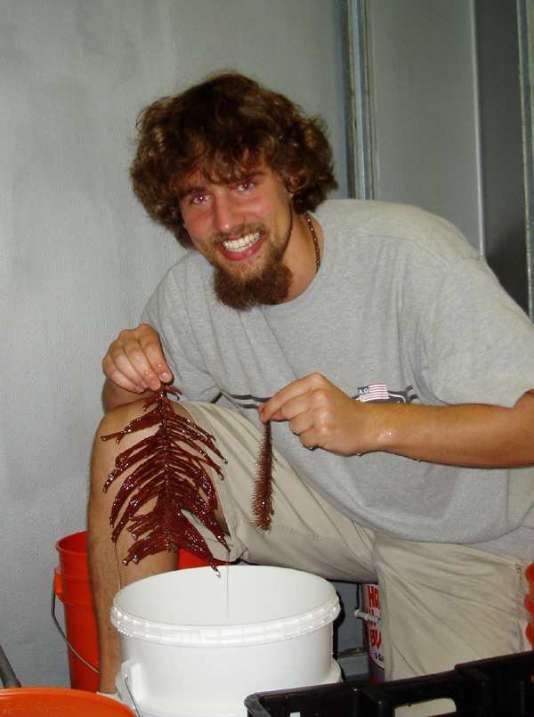 Mercer Brugler holds up a black coral specimen