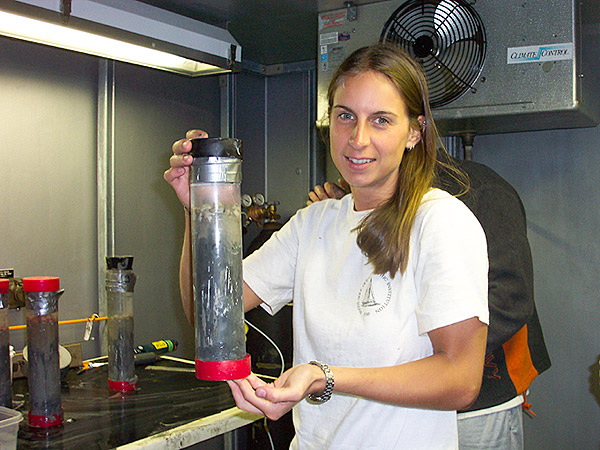 Taylor Heyl holding a push core from the submersible Alivn.